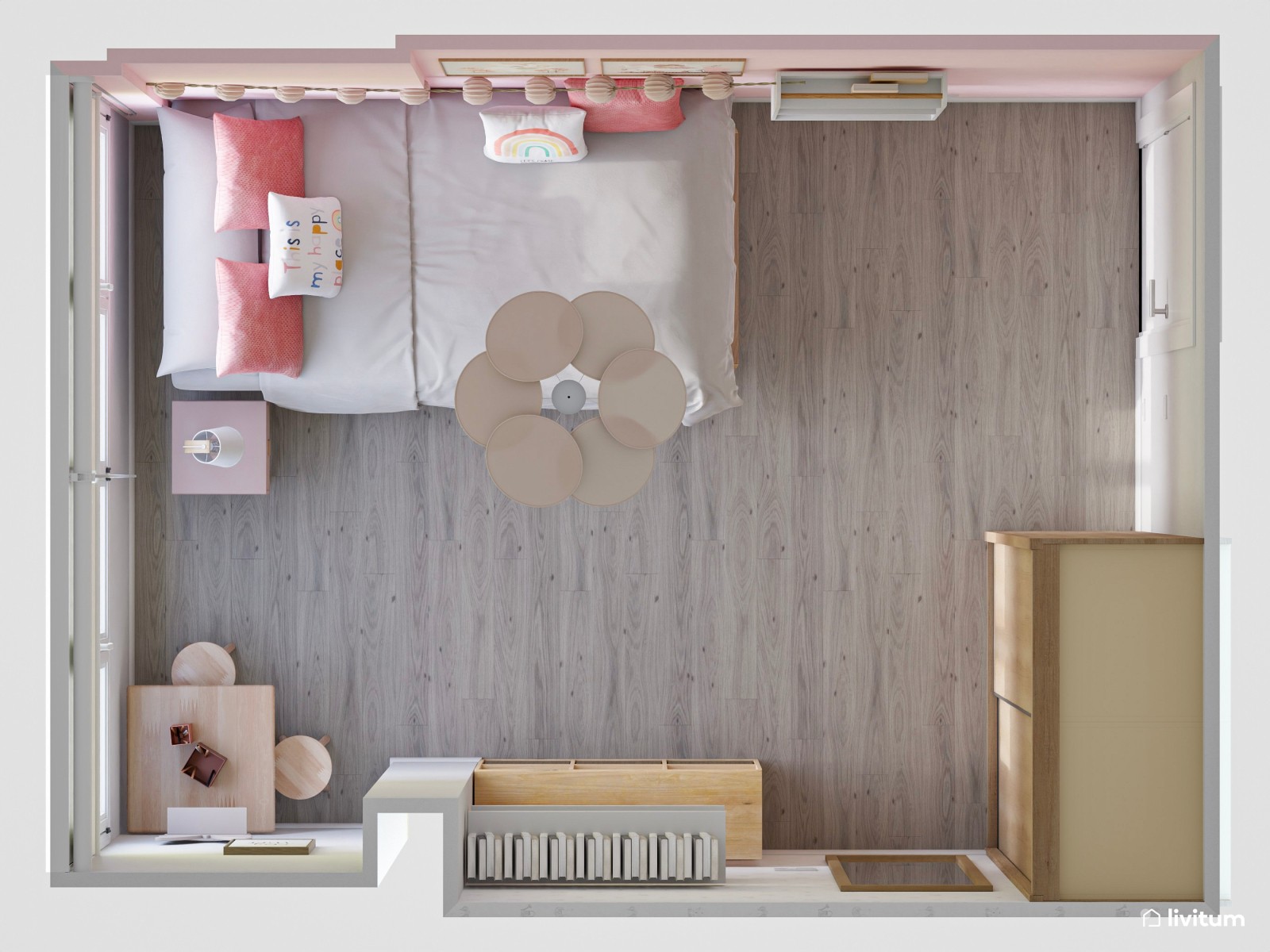 Dormitorio infantil con mesita de juego y decoración rosa