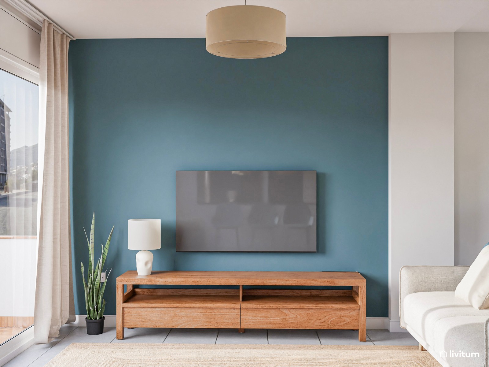 Salón comedor moderno con acentos en azul verdoso y rincón de lectura