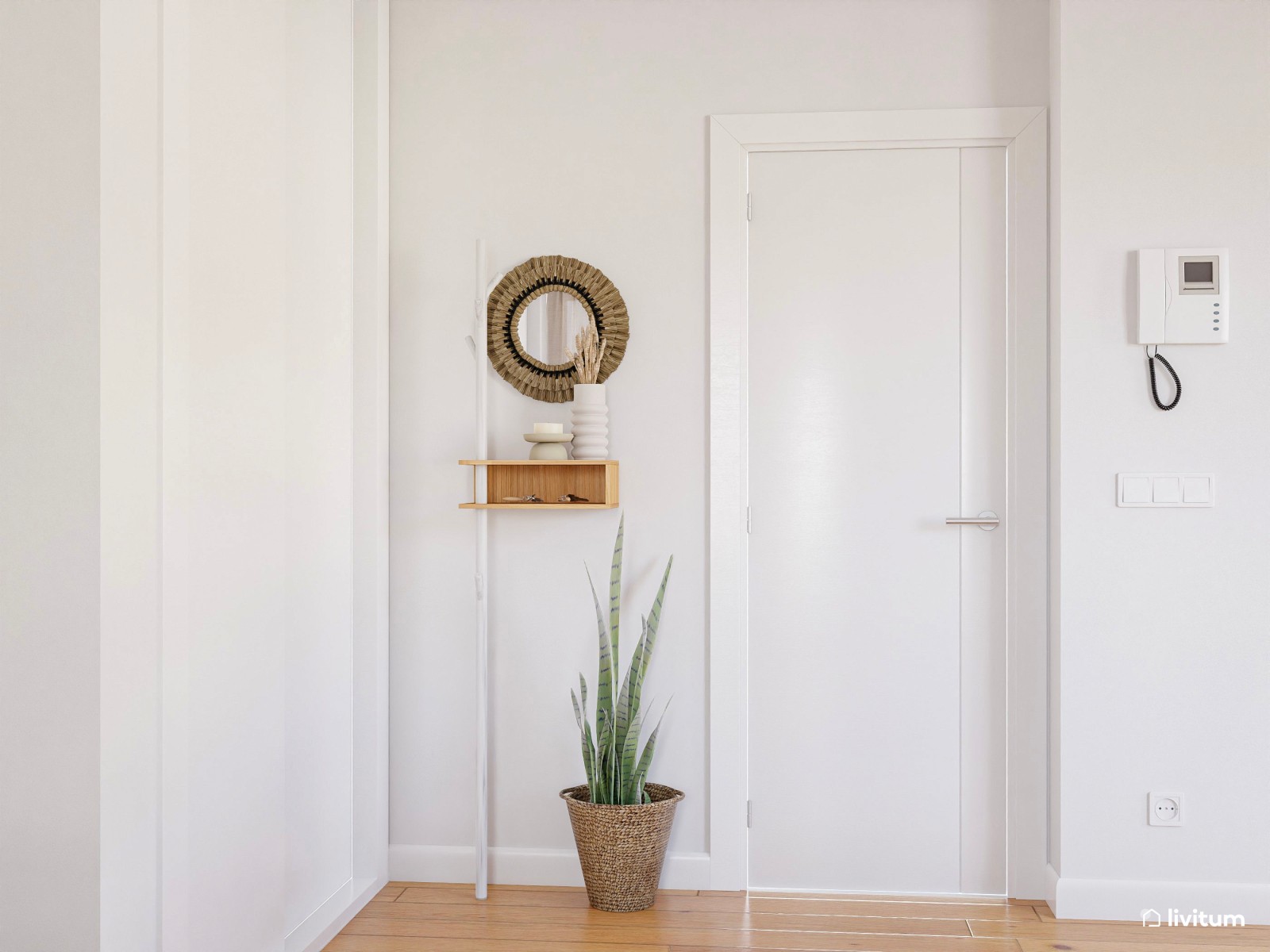 Salón comedor nórdico con suelo de madera y muebles blancos